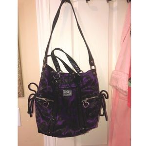 Purple and black coach purse